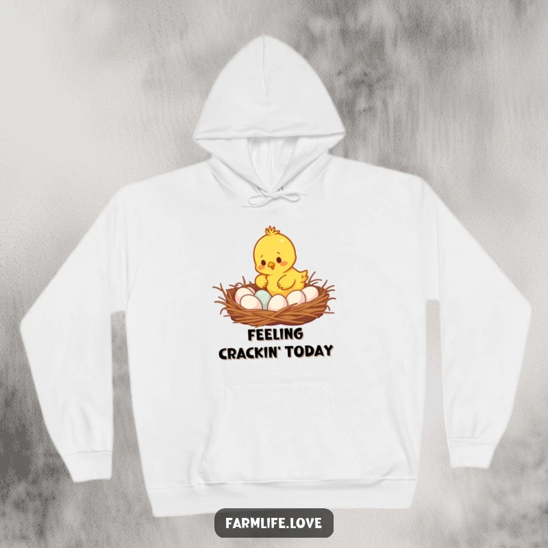 Funny busy yellow chick gathering eggs from a cozy nest, a warm and humorous hoodie for egg lovers and humor enthusiasts.